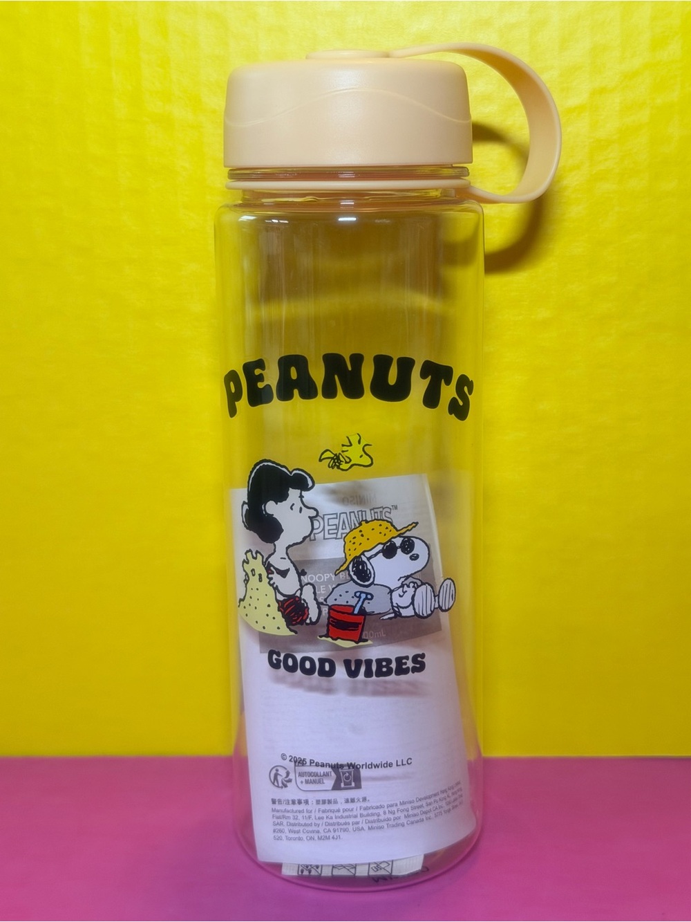 Peanuts Clear Bottle with Yellow Cap and Black Lettering